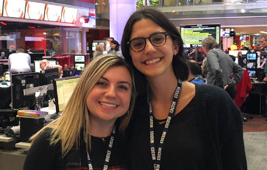 Two Medill students in the BBC newsroom in London.