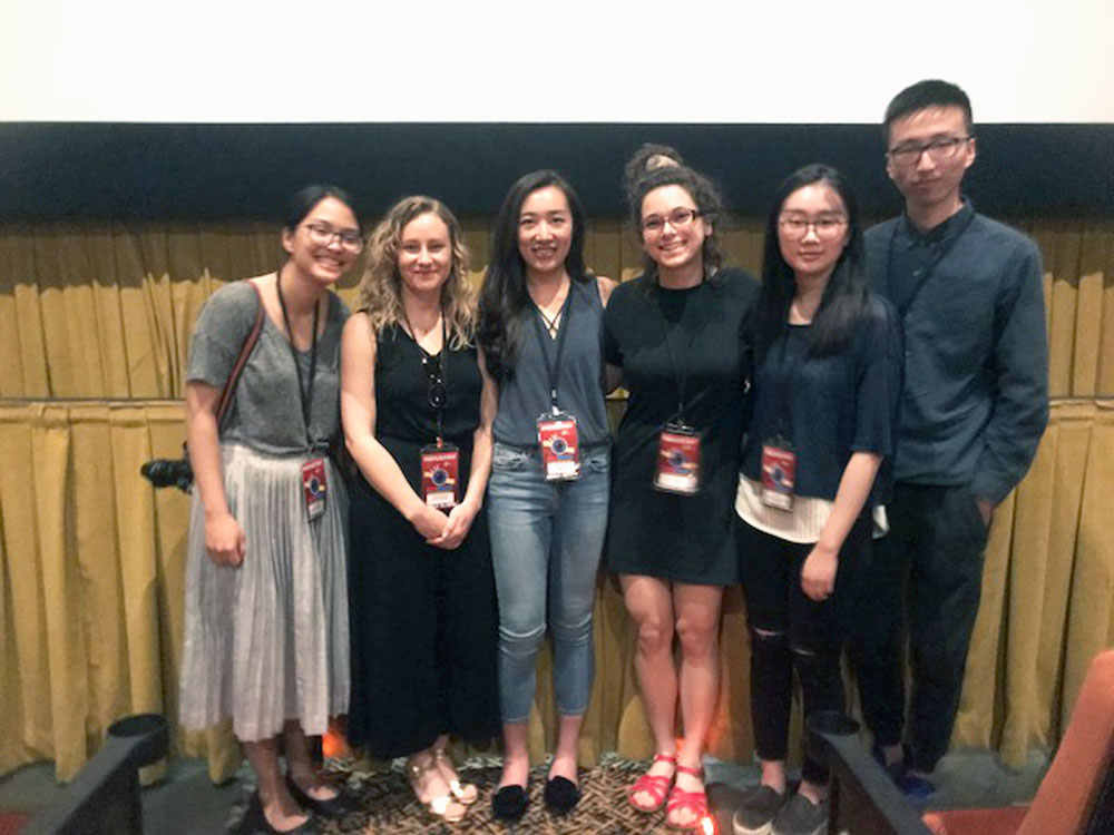 Students pose for a photo at the AmDoc Film Festival