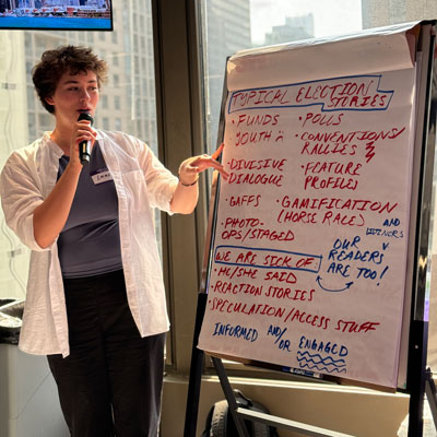 Person presenting at an easel.
