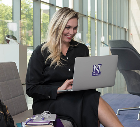 Professional student working at a laptop