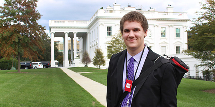Student in front of the white house