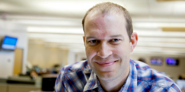 Headshot of Derek L. John