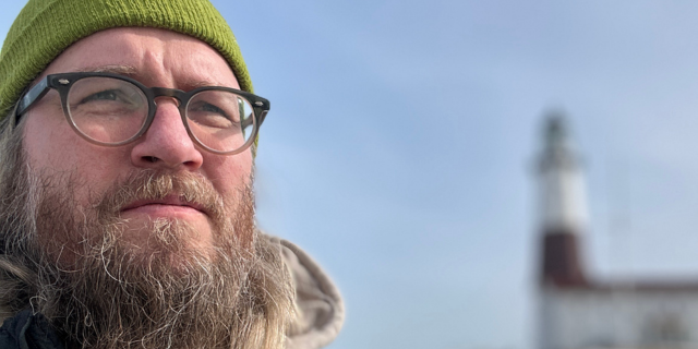 Headshot of John DeLore