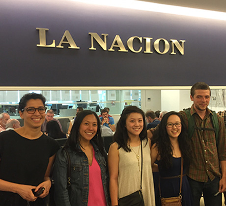 Medill students and faculty in front of La Nacion sign.