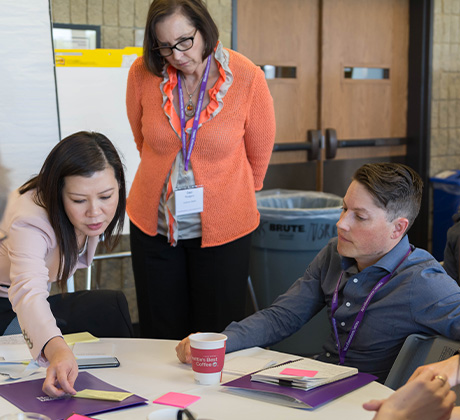 People working together around a table.