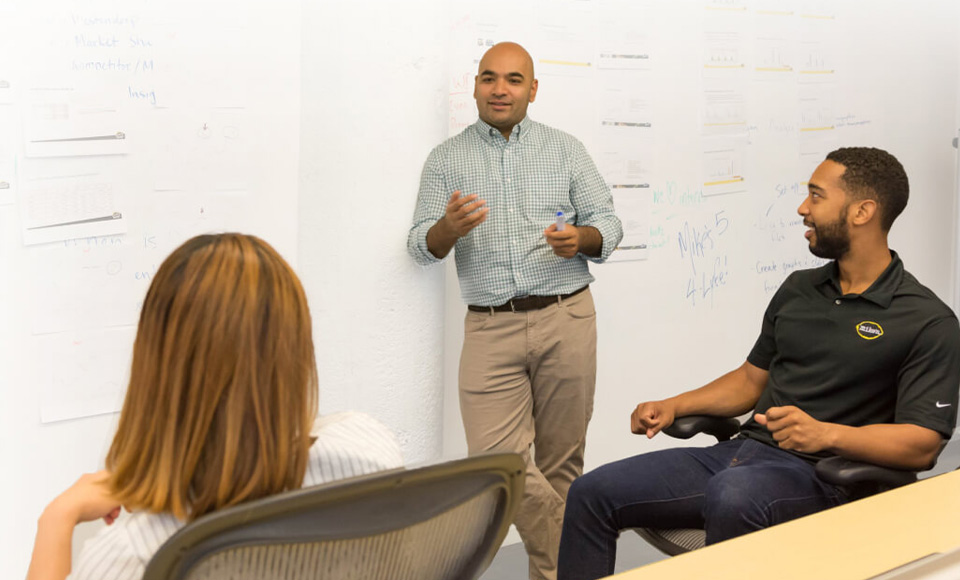 Students presenting at a business