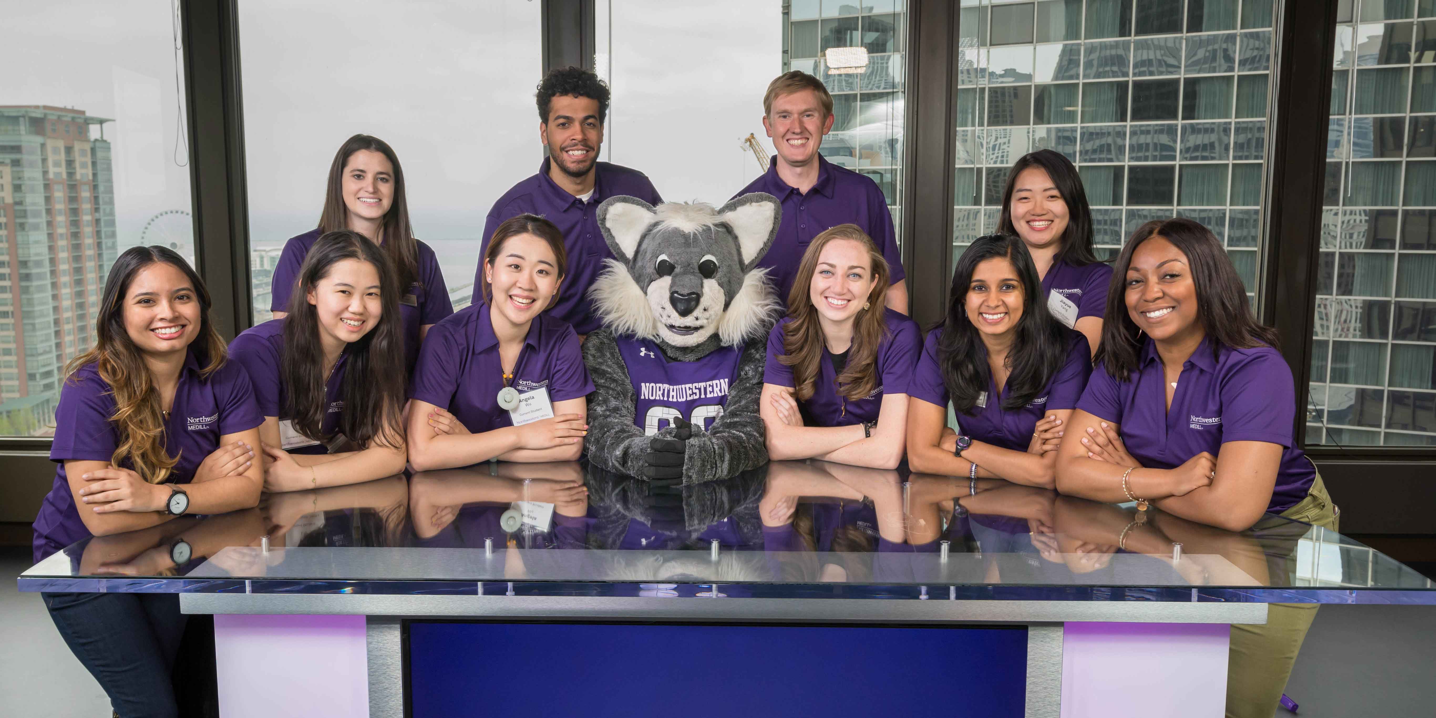 Students Leadership Committee members posing with NU mascot Willie Wildcat