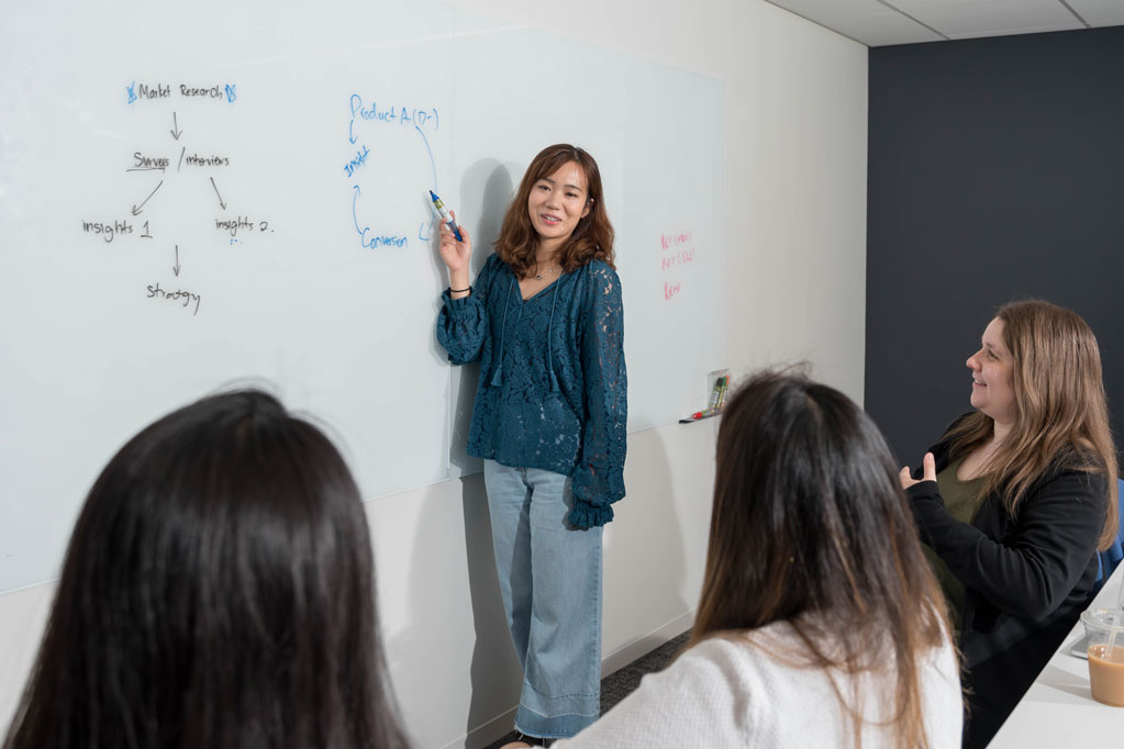 Students in discussion in a conference room