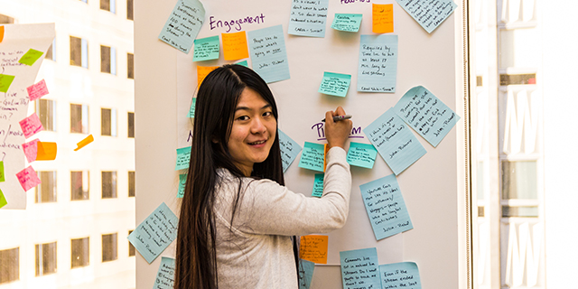 Student working on dry erase board at San Francisco company