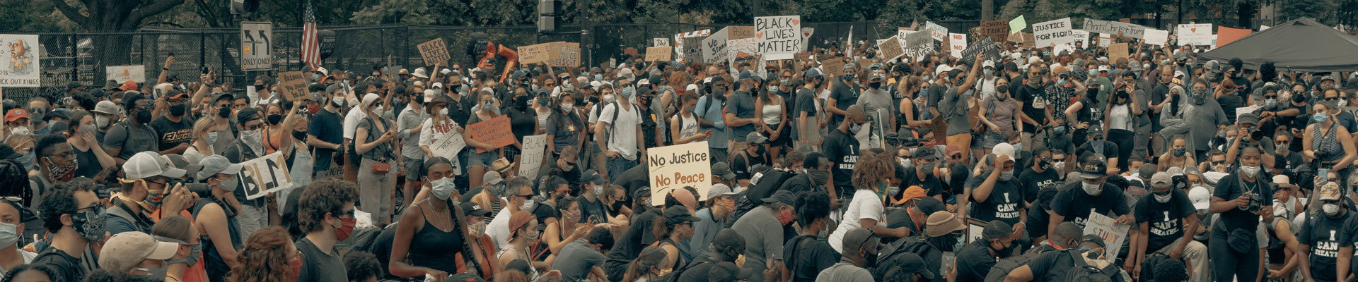 A crowd gathers at a Black Lives Matter protest.