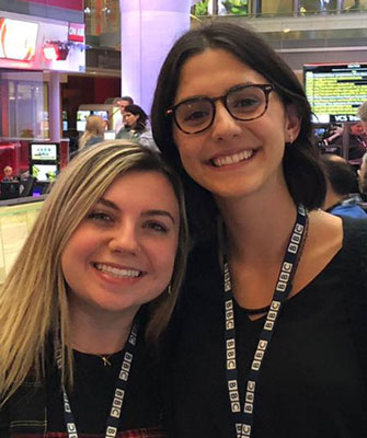 Students pose for photo in the BBC newsroom in London.