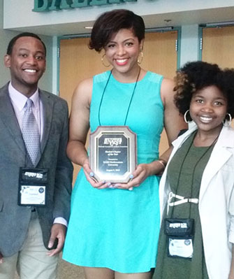 Members of Northwestern's NABJ chapter display the Student Chapter of the Year award they won at the national NABJ convention.