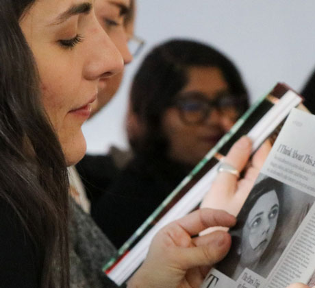 Student reading a magazine.