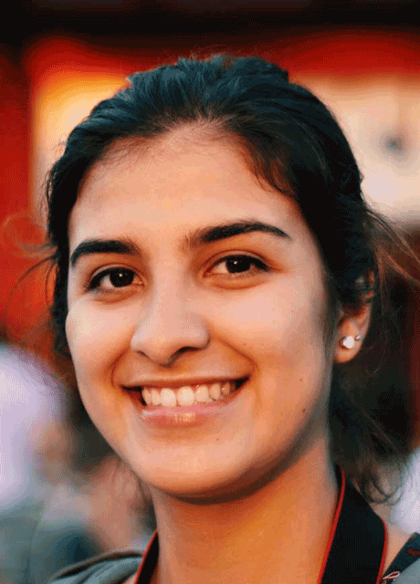 A Medill student poses for a photo while traveling globally with Medill