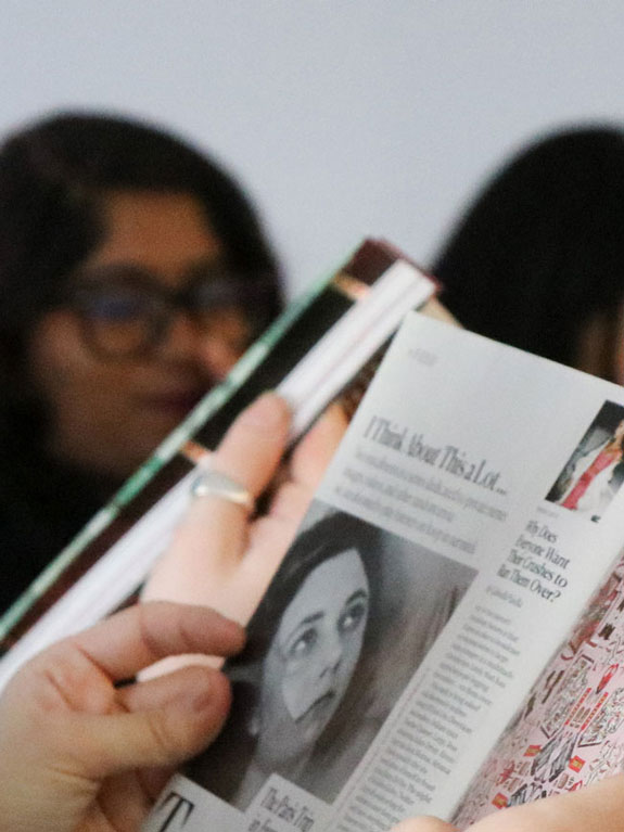 A student reads a magazine
