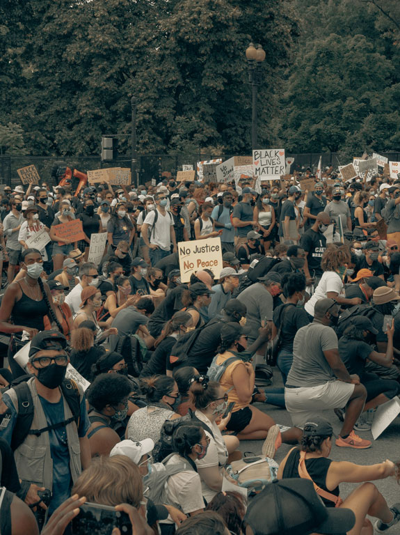 A crowd gathers at a Black Lives Matter protest.