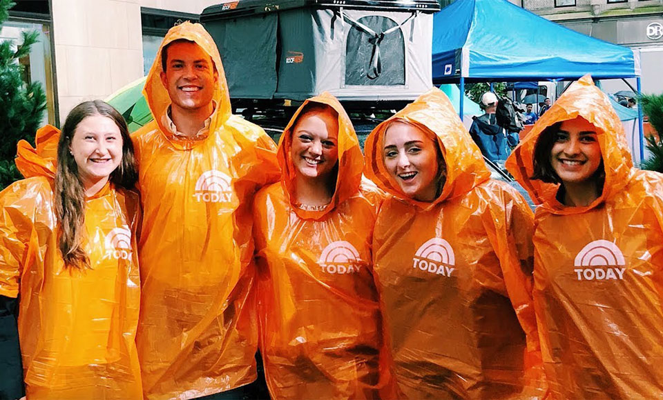 Students wearing orange Today Show parkas. 