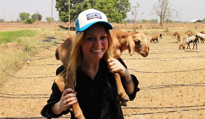 Janice Cantieri holding a goat in India