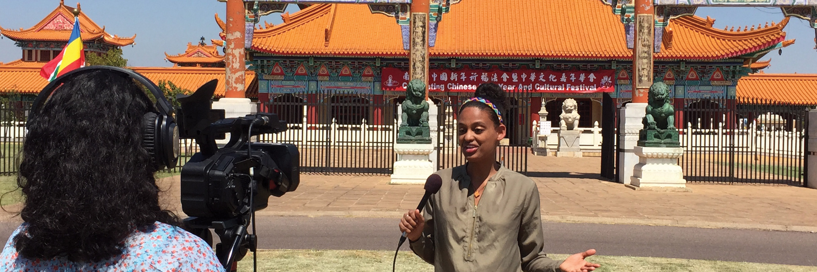 Medill MSJ student records a television segment in Asia.