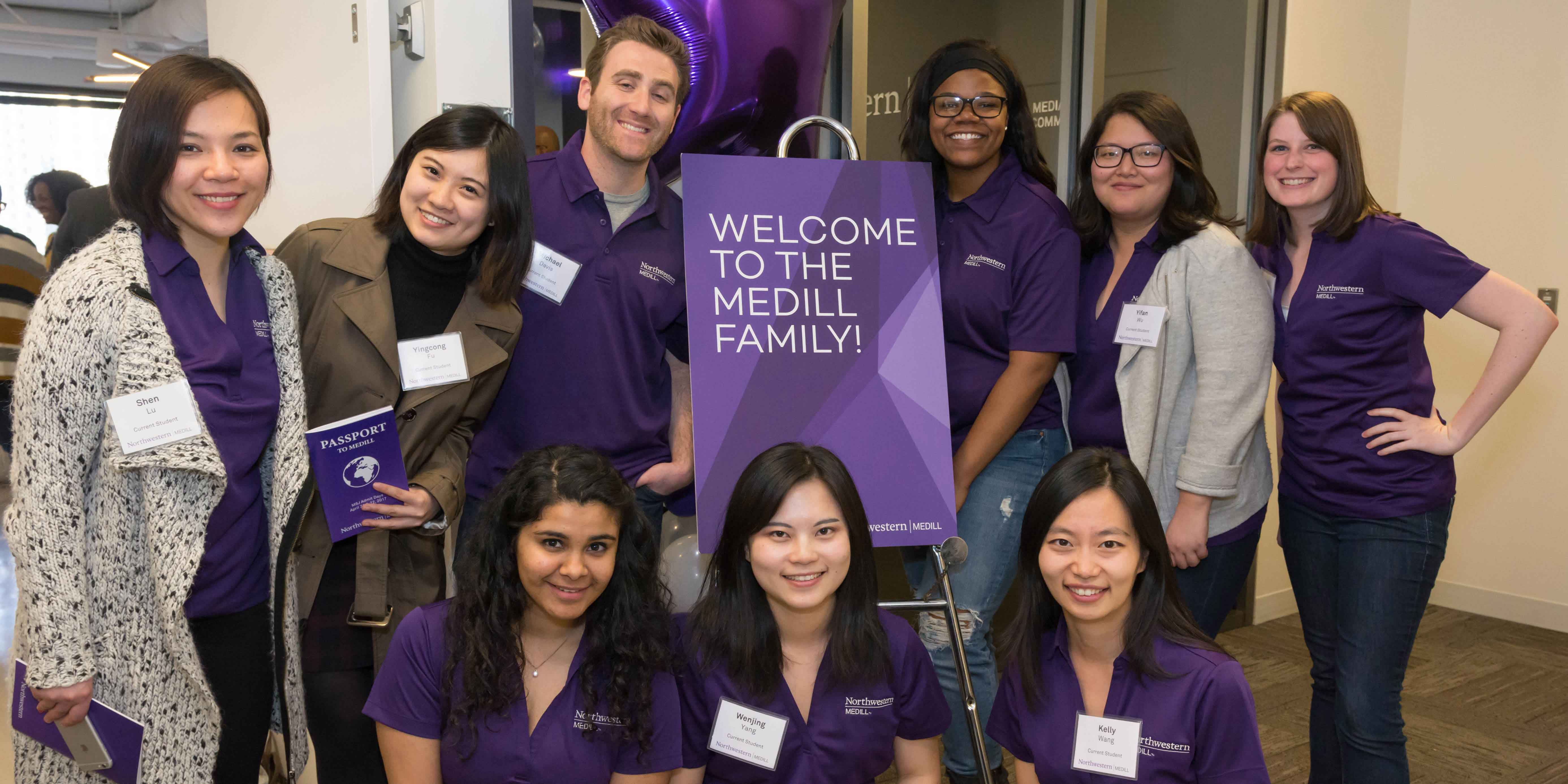 Graduate journalism leadership council posing with a "welcome" sign