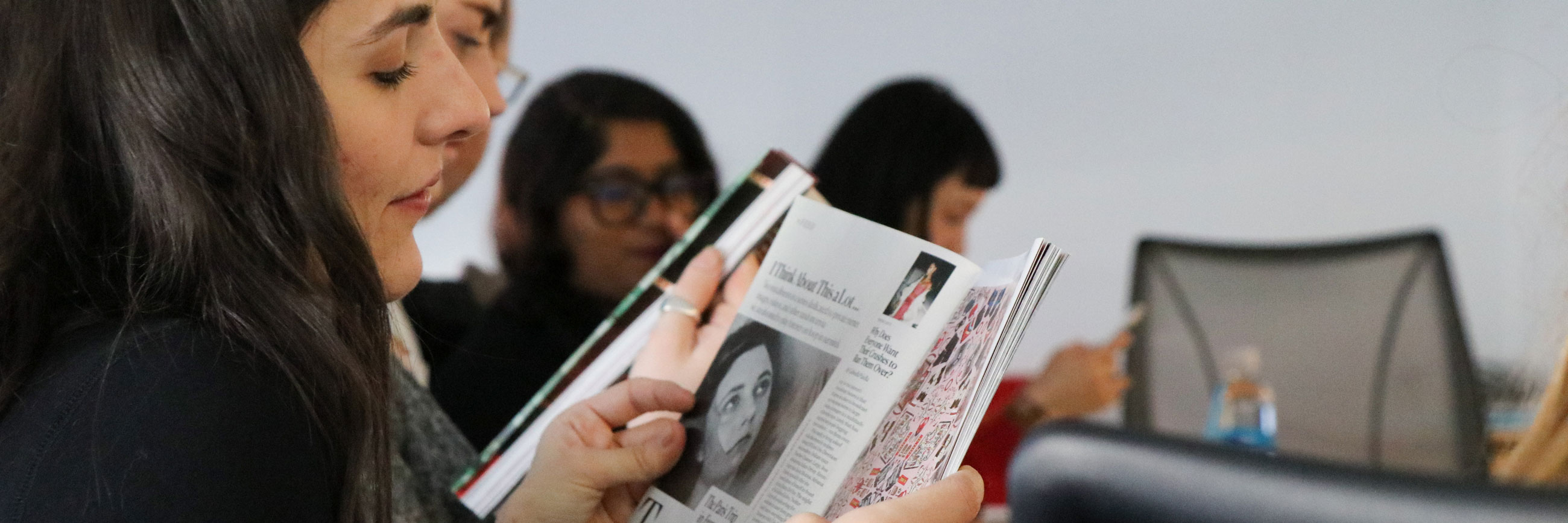 A student reads a magazine