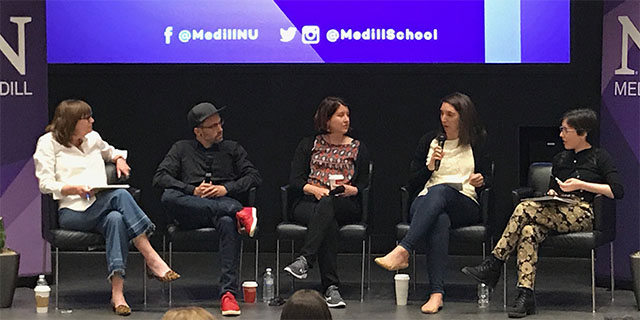 Group panel discussion in auditorium 