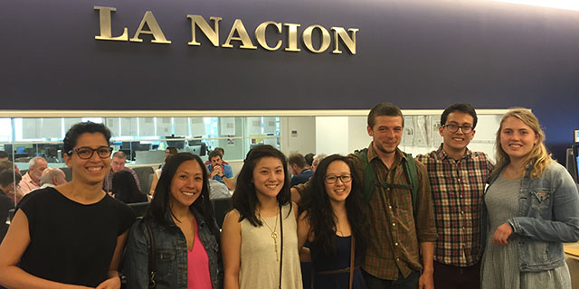 Students standing in front of La Nacio newsroom in Argentina.