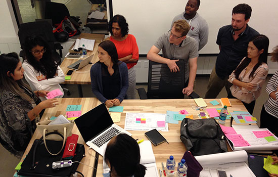 Students collaborate inside the San Francisco newsroom.