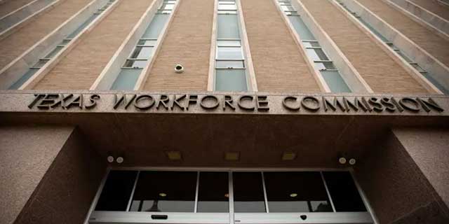 Photo of a multi-story brick building with a sign that reads Texas Workforce Commission.