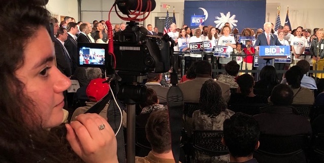 A student shoots video at a Joe Biden campaign event in South Carolina.