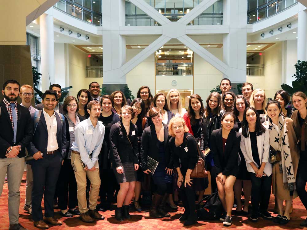 Students and faculty members pose for a group photo at the National Institutes of Health