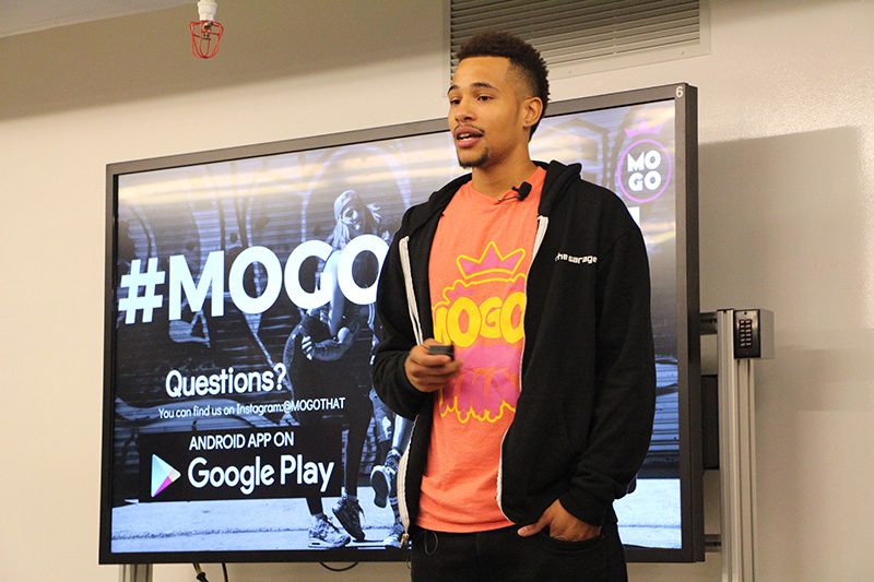 A Black student gives a presentation at The Garage.