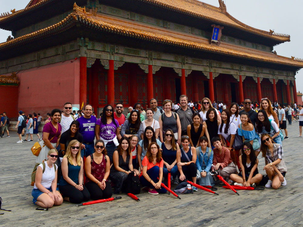 Medill IMC students pose for a photo at the Forbidden City in Beijing
