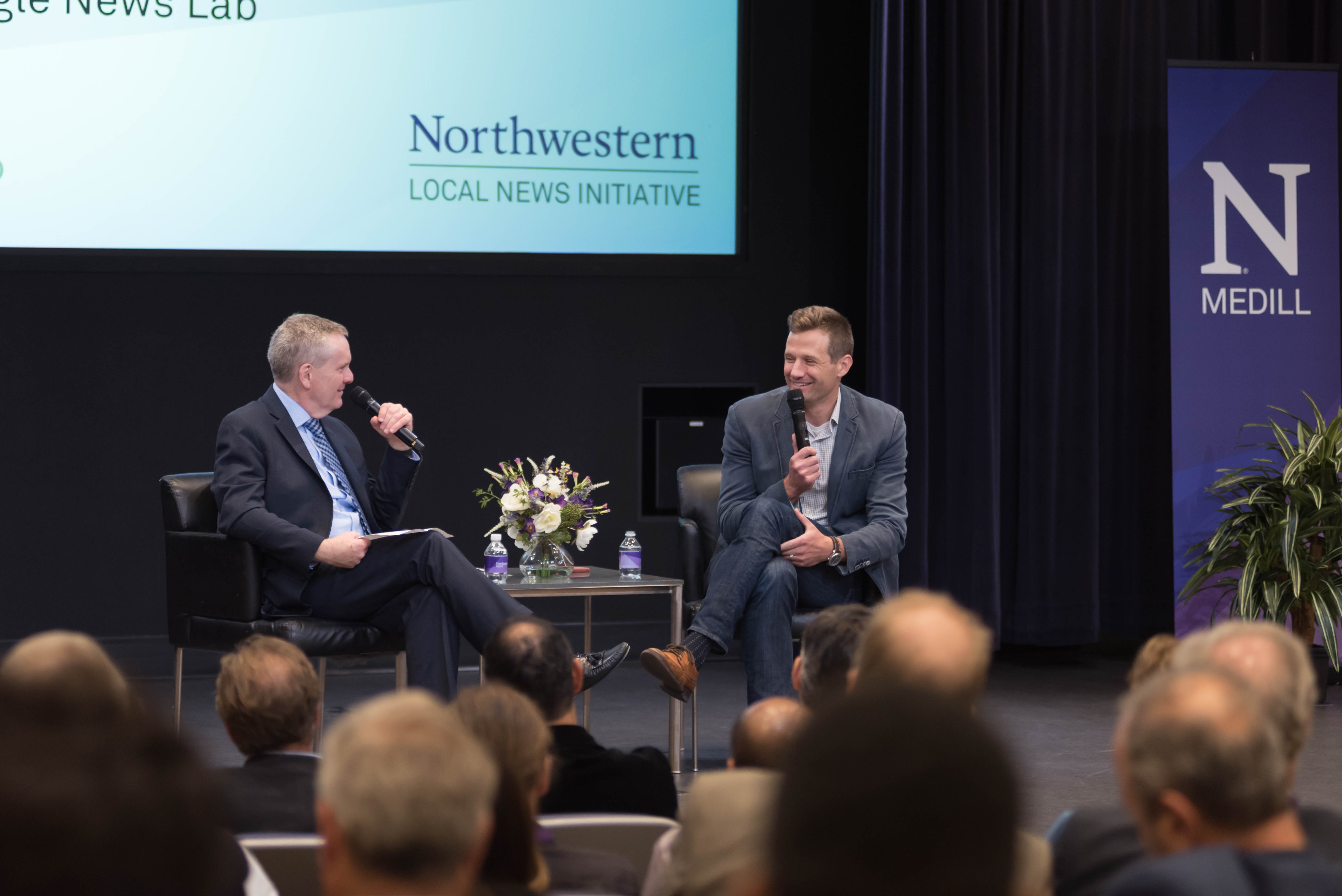 Google News Lab's Steve Grove speaks on stage at Medill about local news