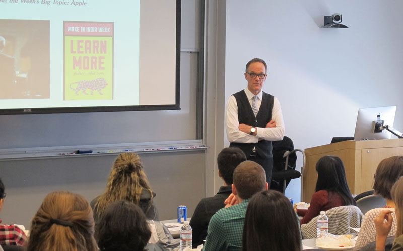 Wide shot of Dean Murphy speaking with students.