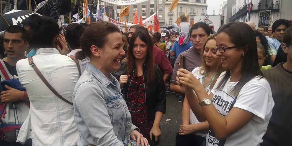 Meg Anderson stops for an interview with another student journalist.