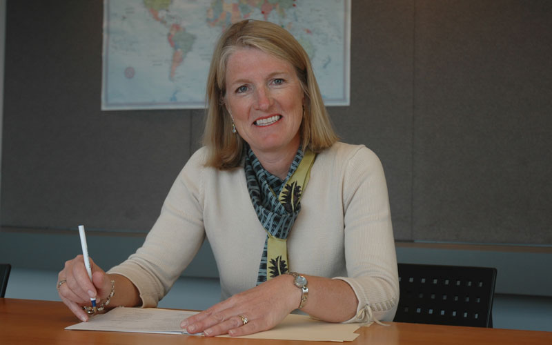 Karen Brown seated at a desk.