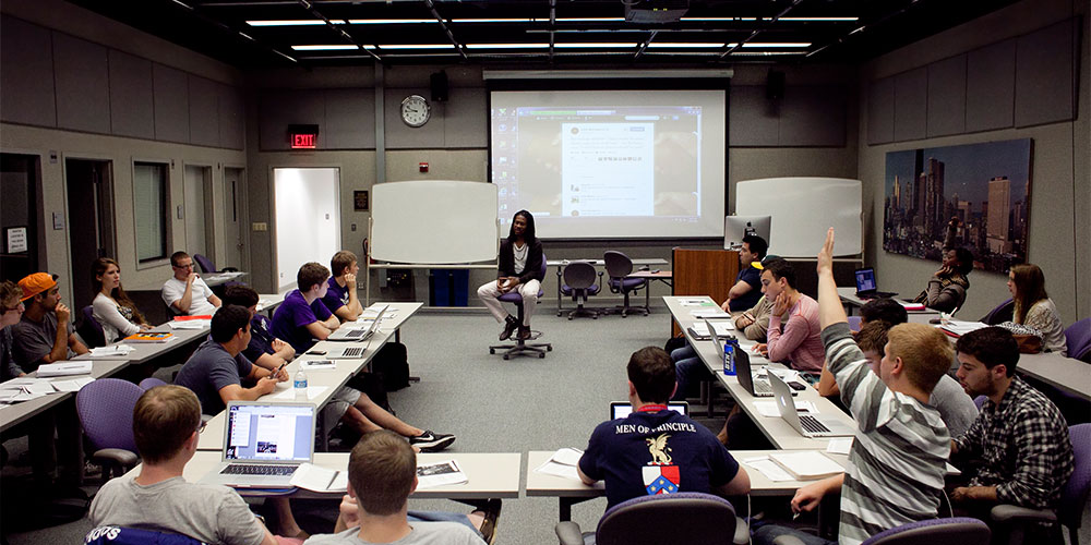 LZ Granderson speaking to a classroom full of students.