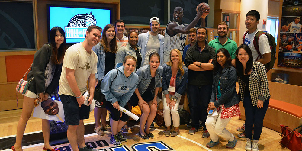 Students gather for a photo before the Orlando Magic game beings at the Amway Center