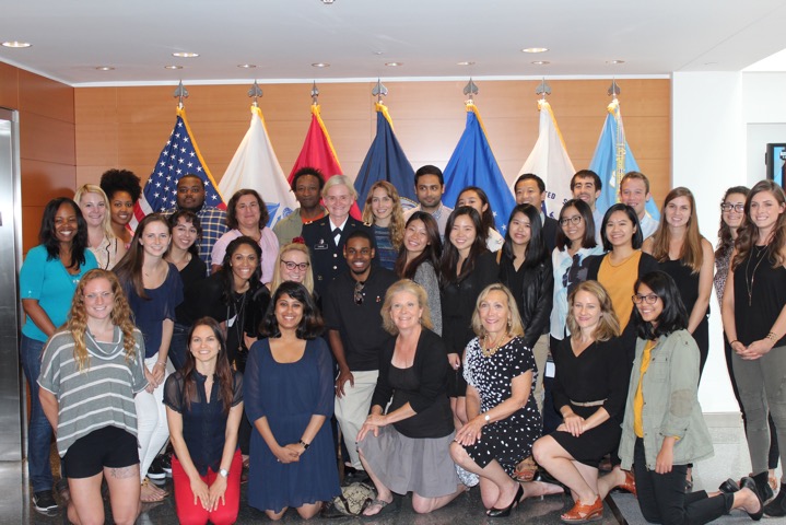 A group photo of students, faculty and presenters at Medill's health care conference