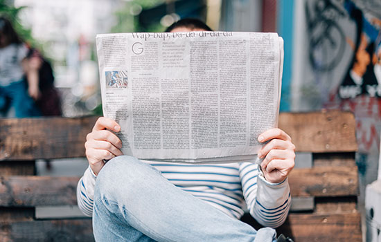 man reading a newspaper