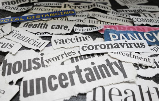 Newspaper clippings from coronavirus-related headlines