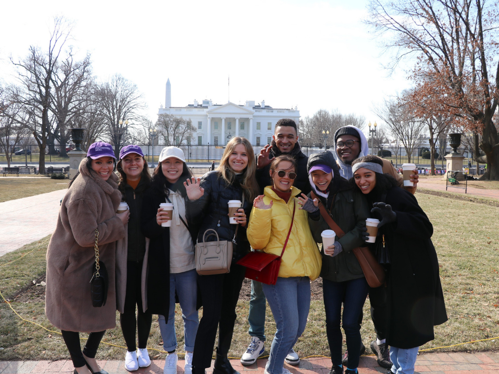 Students pose in front of the White House in Washington, D.C.